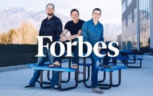 a trio of men featuring on Forbes newspaper